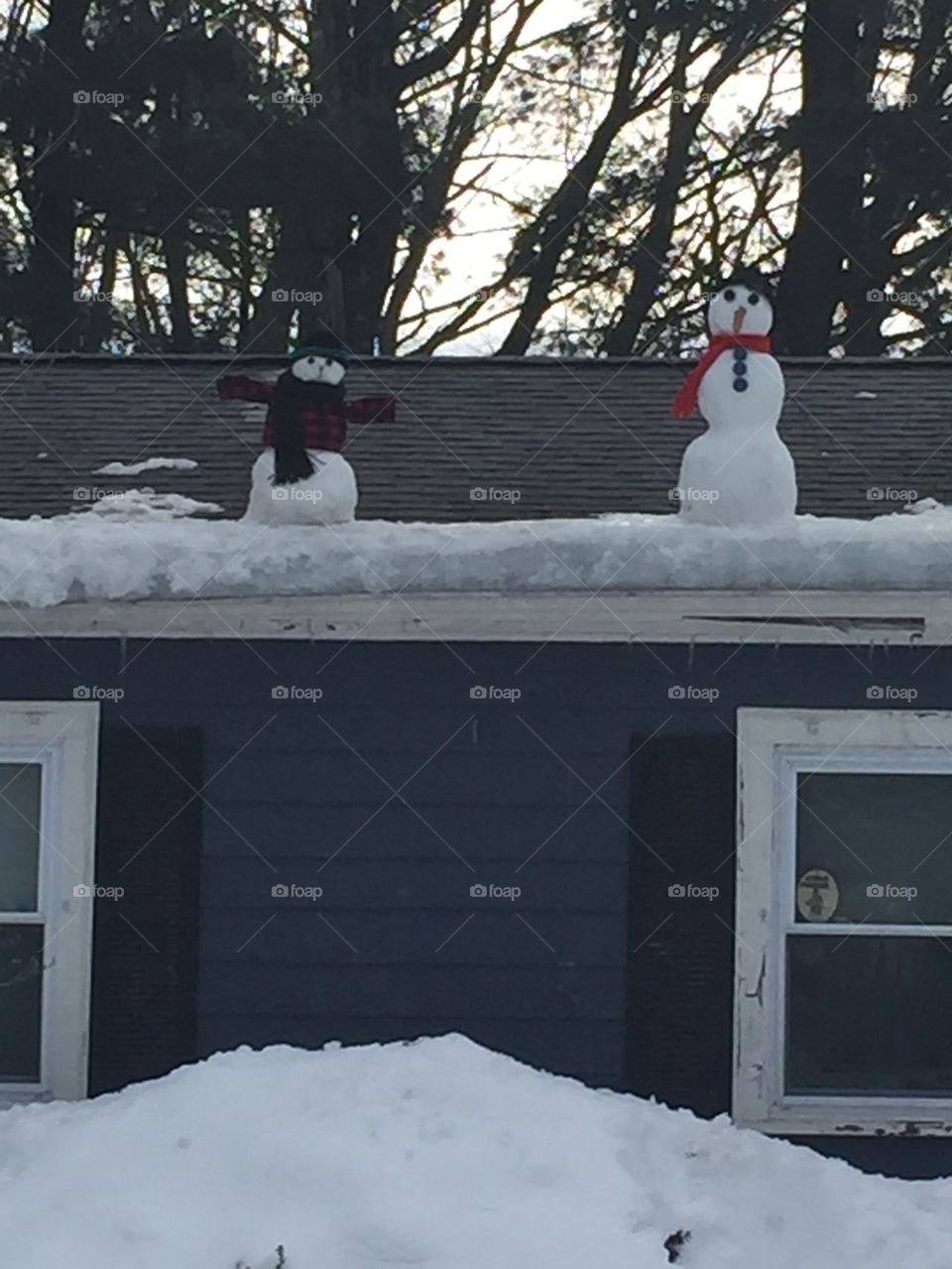 Snow people on the roof