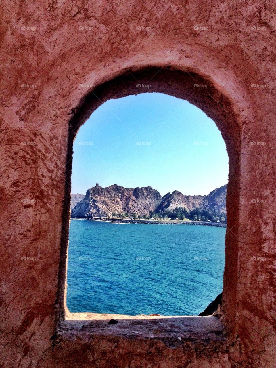 View of sea through window