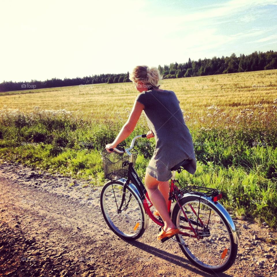 A woman cycling in the countryside 