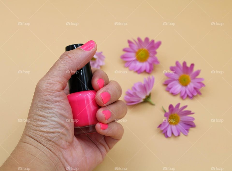 The pink nail polish with pink flowers