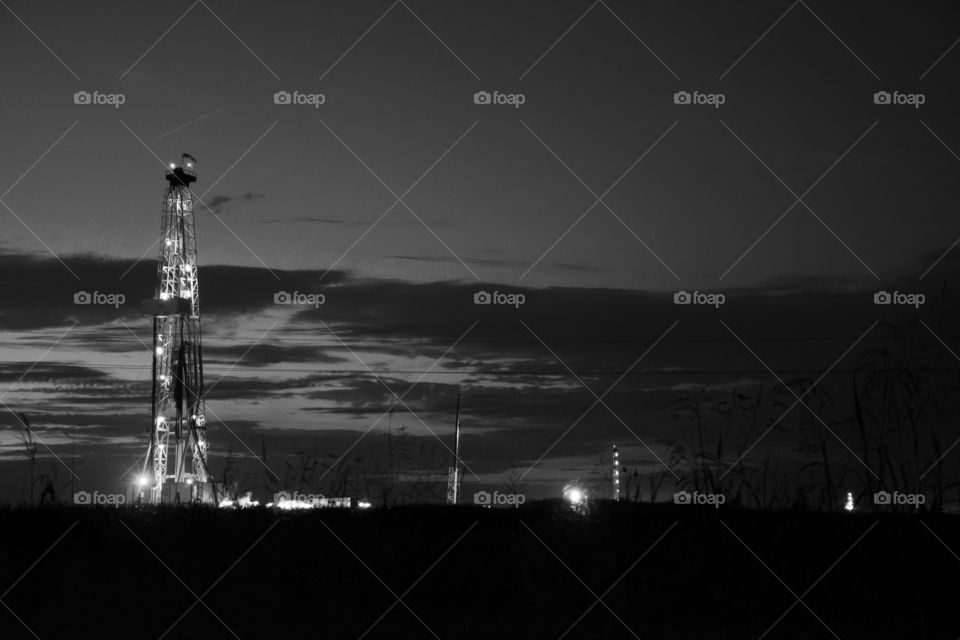 oil platform at night. oil platform at night in the middle of corn  field