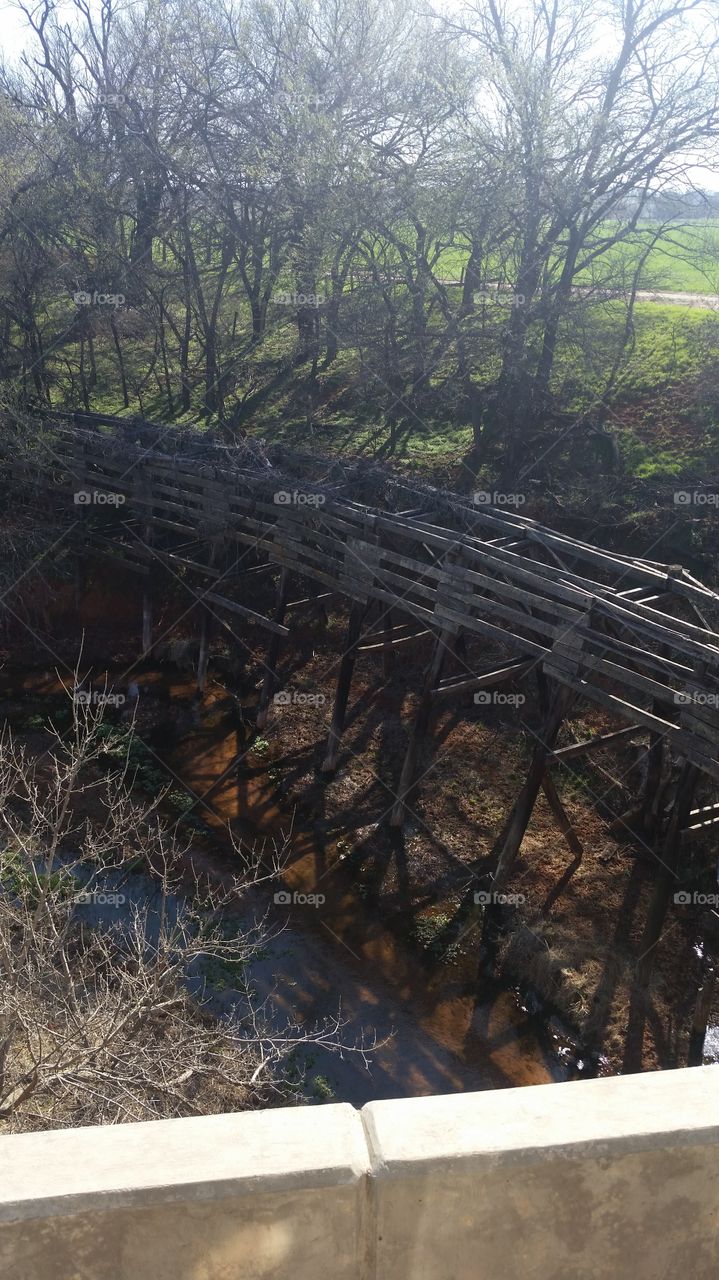 The old tressel by the creek!. Drive by it daily just shows the good lasting workmanship.  I think it's cool a monument to past!