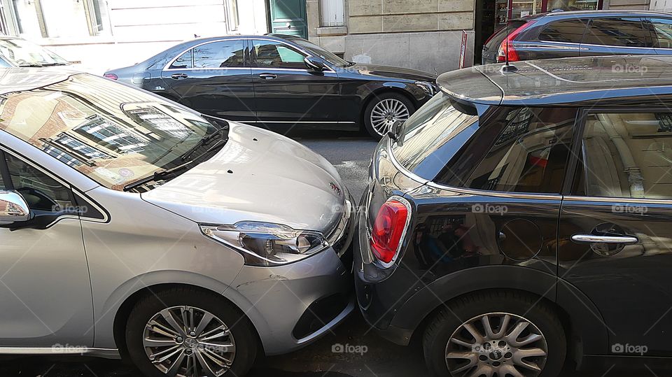 
This is pretty much normal parking in congested European cities. I watched a lady park her car like this before she went shopping. No room in front and no room in the rear to get out