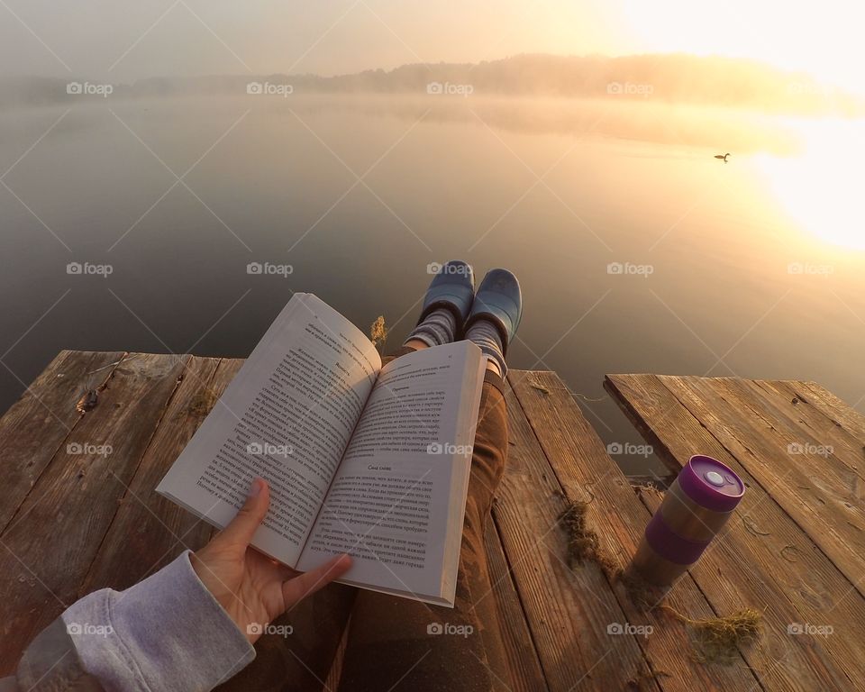 Breakfast with coffee and a book enjoying sunrise on the bridge 