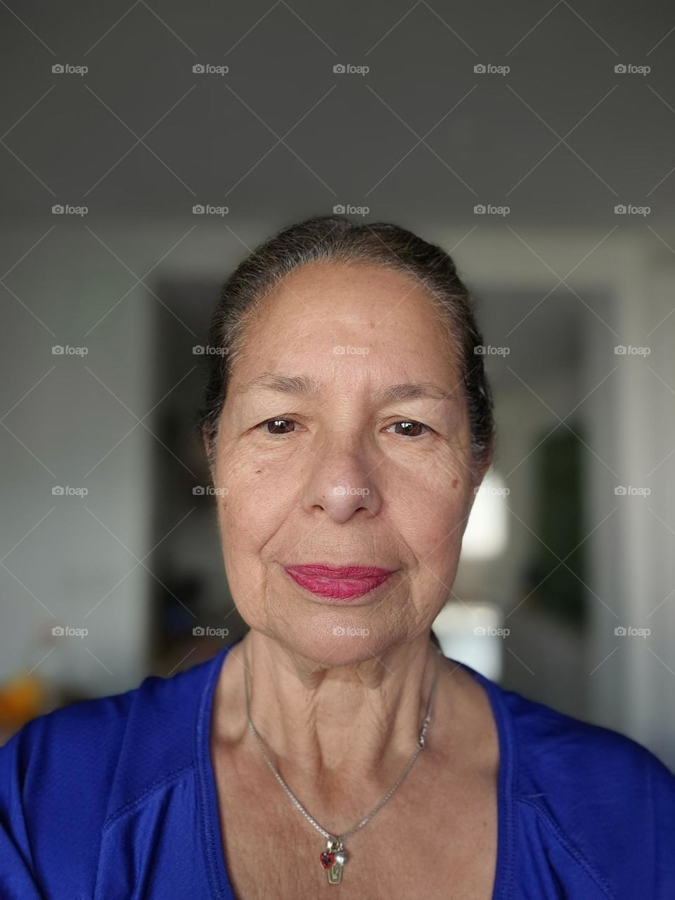 It is about a beauty concept. Woman shows signs of her unique story of passing of time. Wrinkles, spots, and uneven pigmentation are all part of aging and loss of elasticity. Nevertheless, she feels beautiful and young and youthful, full of energy.