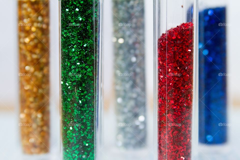 Detail of colored glitter in tubes
