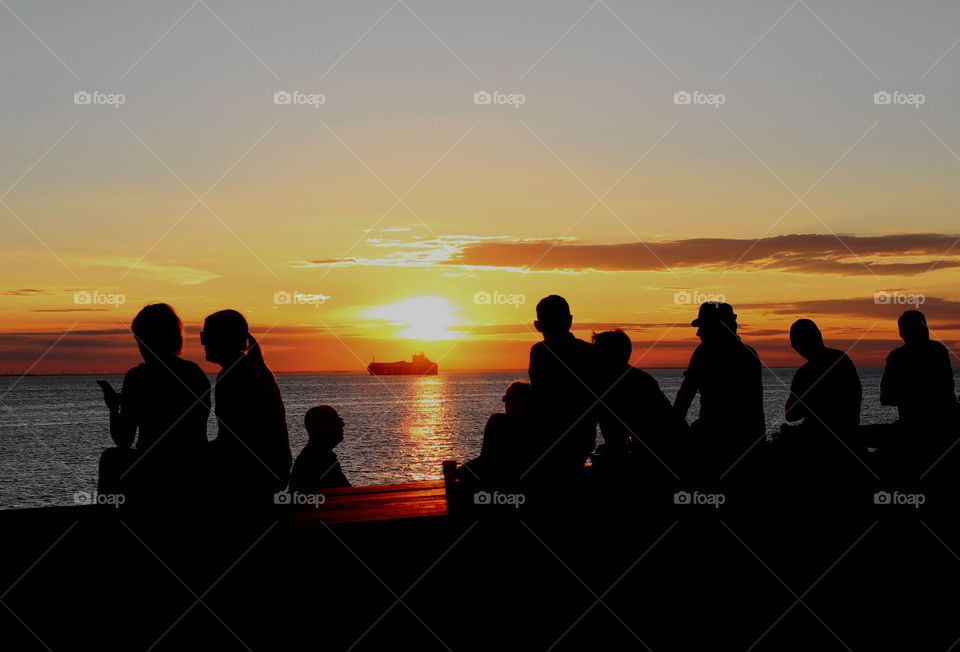 People enjoying the sunset in Malmö.