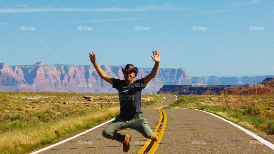 Man jumping on empty street
