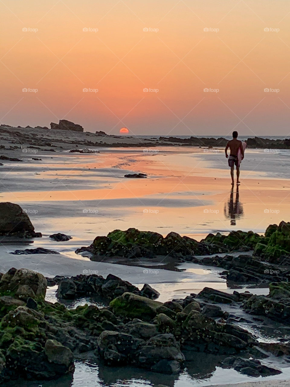 Boys with surf walking in the beach 