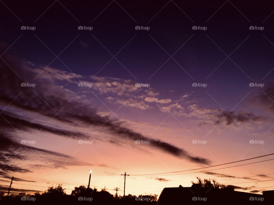 Clouds moving in maybe stormy by end of day. Unusual cloud formation brining colours into the picture. 