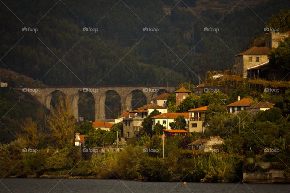 mountain river bridge houses by ponchokid