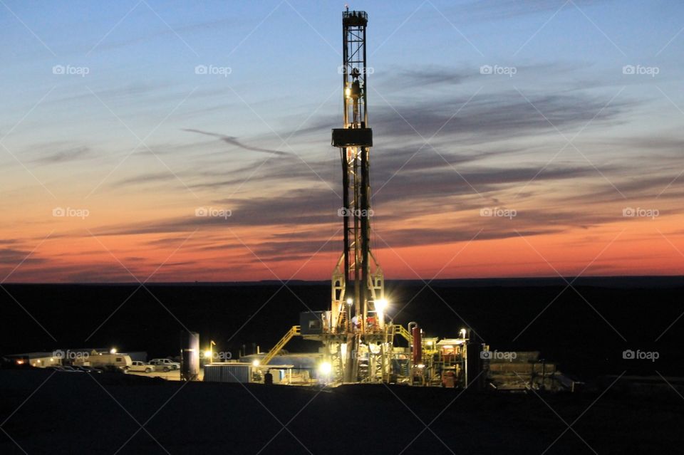 Drilling rig at sunset