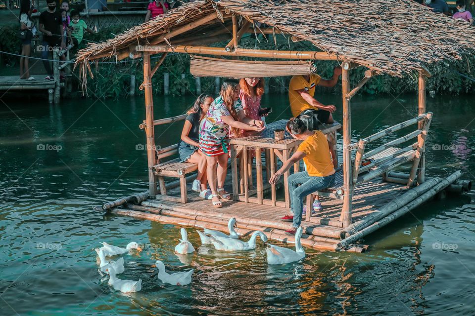 Happy family on a floating cottage