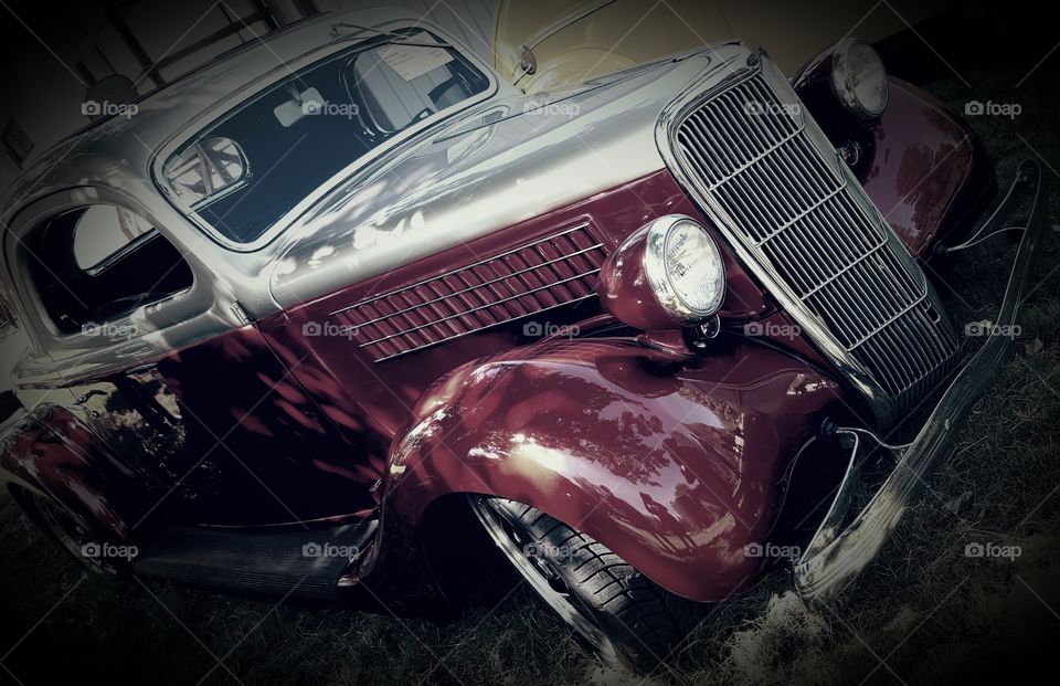 A sunny day at a car show. I edited the coloring to tone down the brightness and to shae away some of the background and highlight the car.