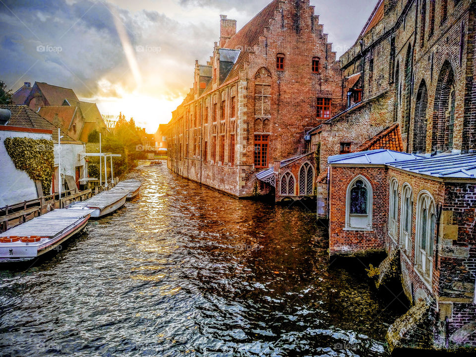 Sunset over the canals of Bruges city, in Belgium