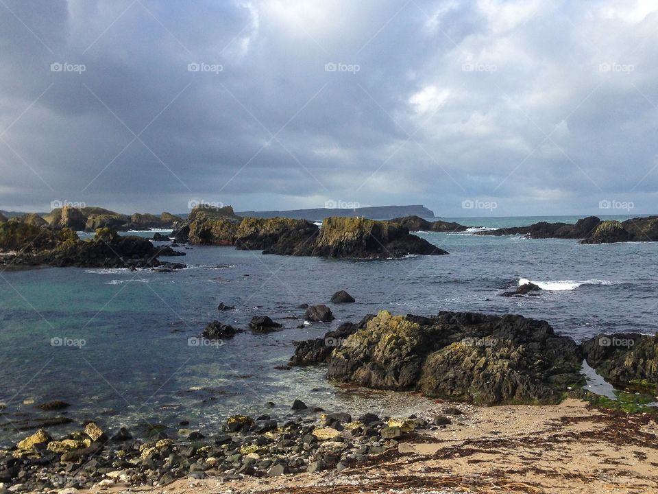 Sea over the cloudy sky