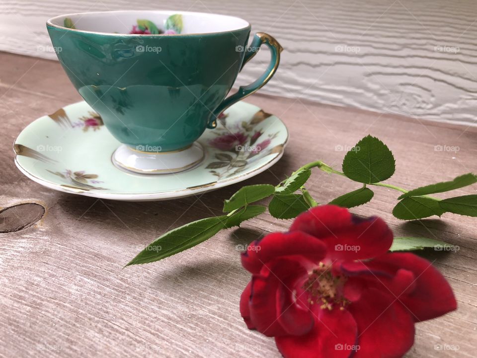 Fancy tea cup with rose looking romantic and inviting