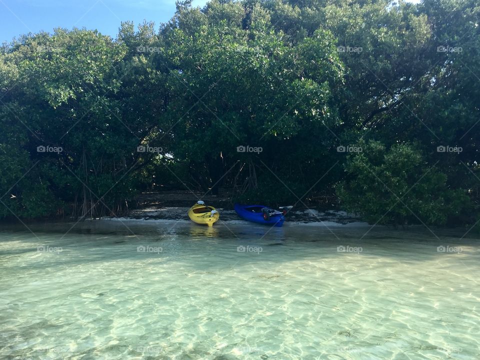 Deserted island kayak trip, crystal waters.
