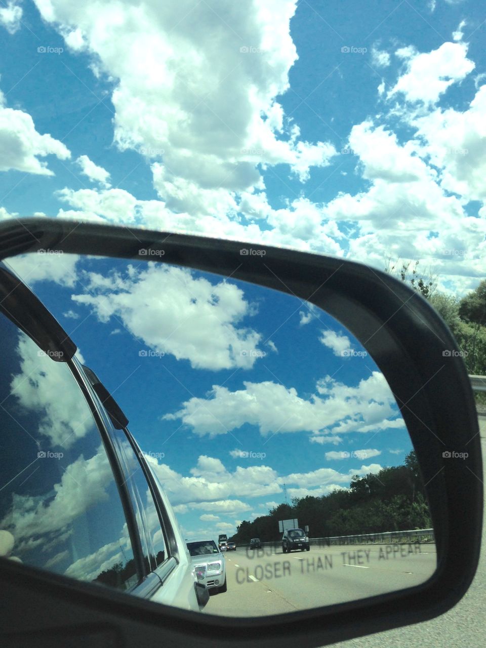 Rear View Mirror Clouds in Back & Front
In the SUV, all I saw was fluffy clouds in back of us and fluffy clouds in front of us! The blue sky was beautiful too!