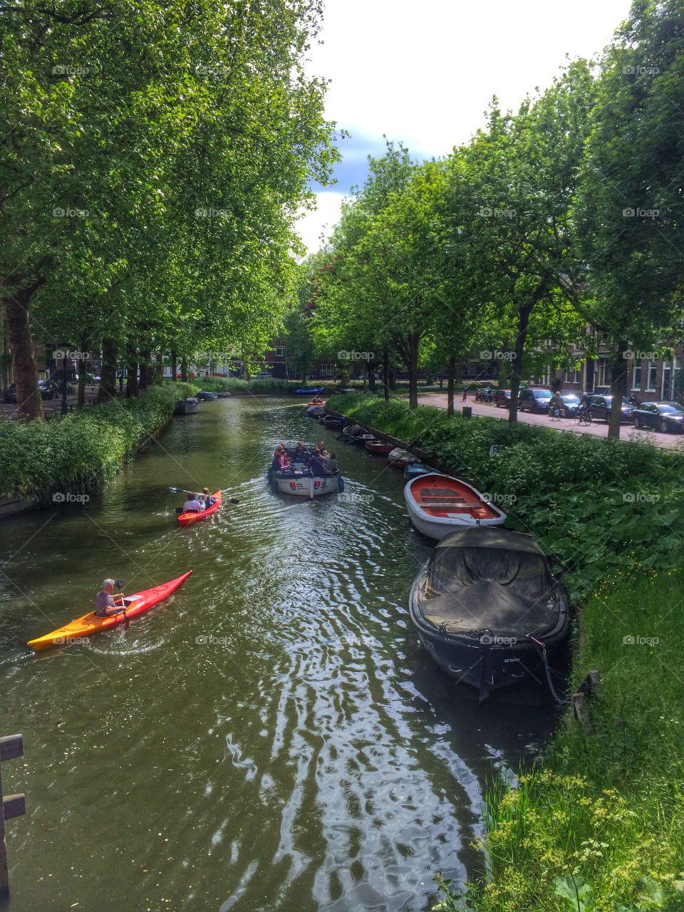 Paddling in Utrecht . Kayakers paddling a canal in Utrecht 