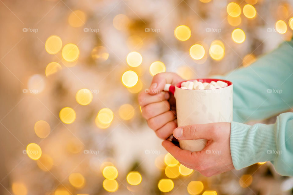 cup of coffee in a cozy festive Christmas atmosphere