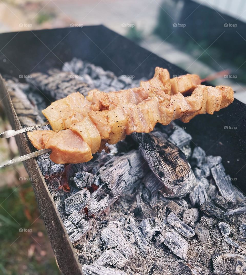 Cooking meat on the brazier