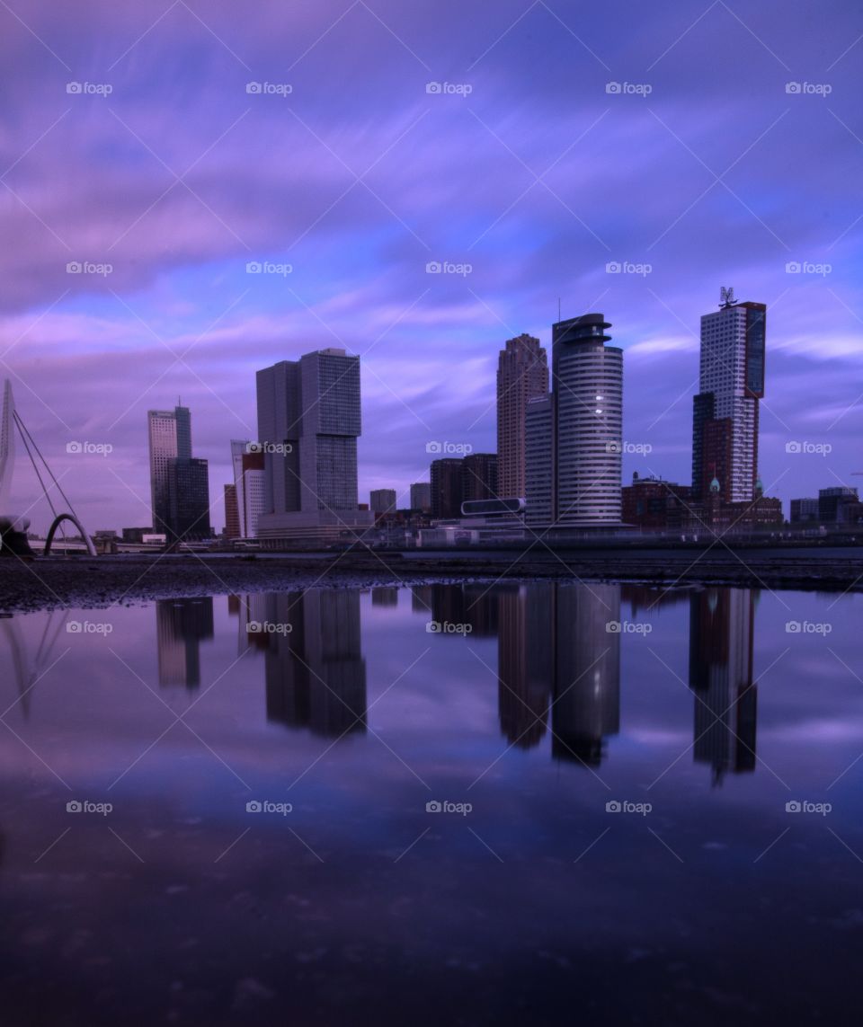 The tall buildings of Rotterdam under reflection