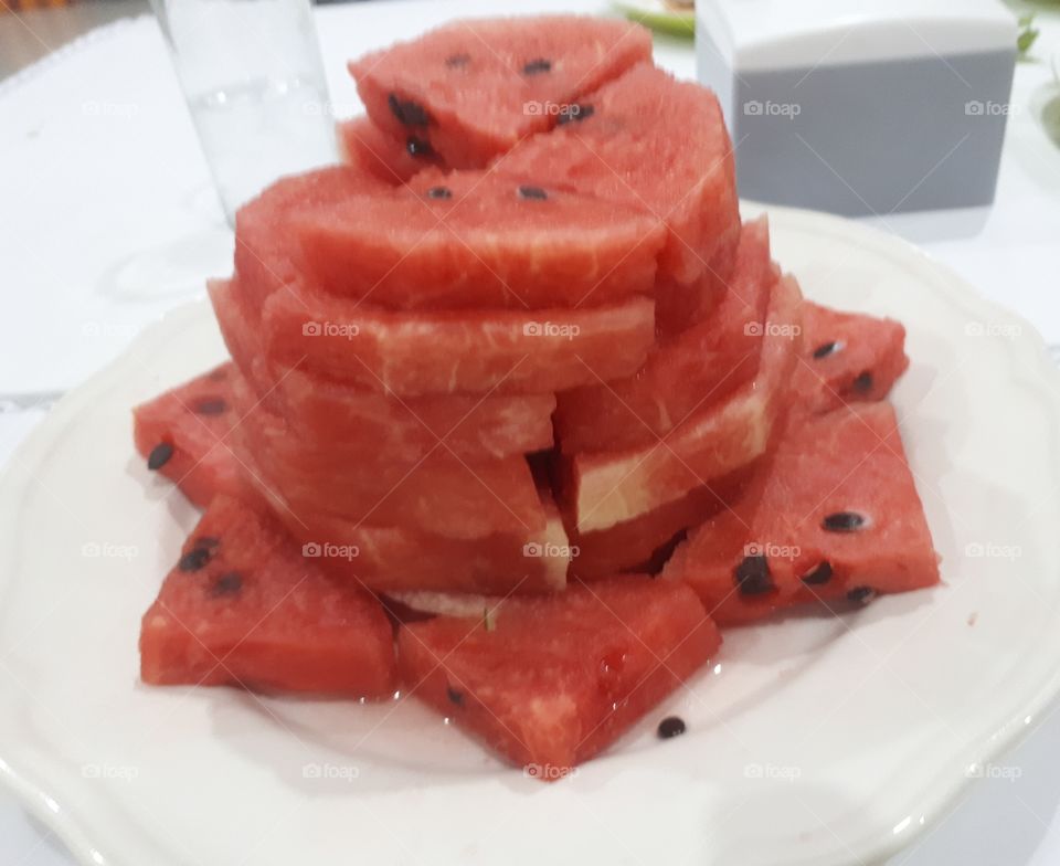Watermelon sliced on white plate