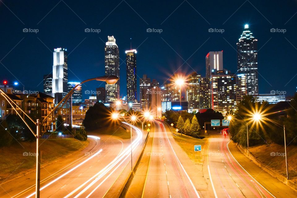 Busy night hour in Atlanta, long exposure view on a bridge