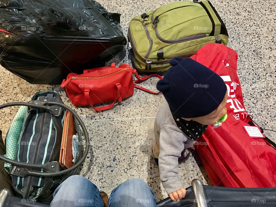 Luggage and a baby at the airport