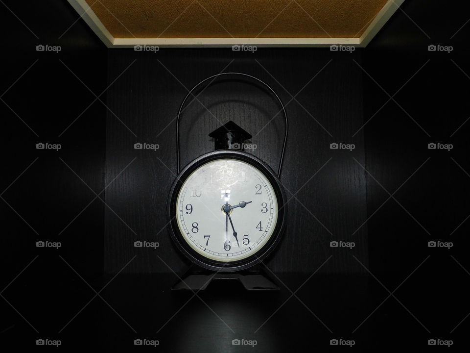 nice clock in black shelf