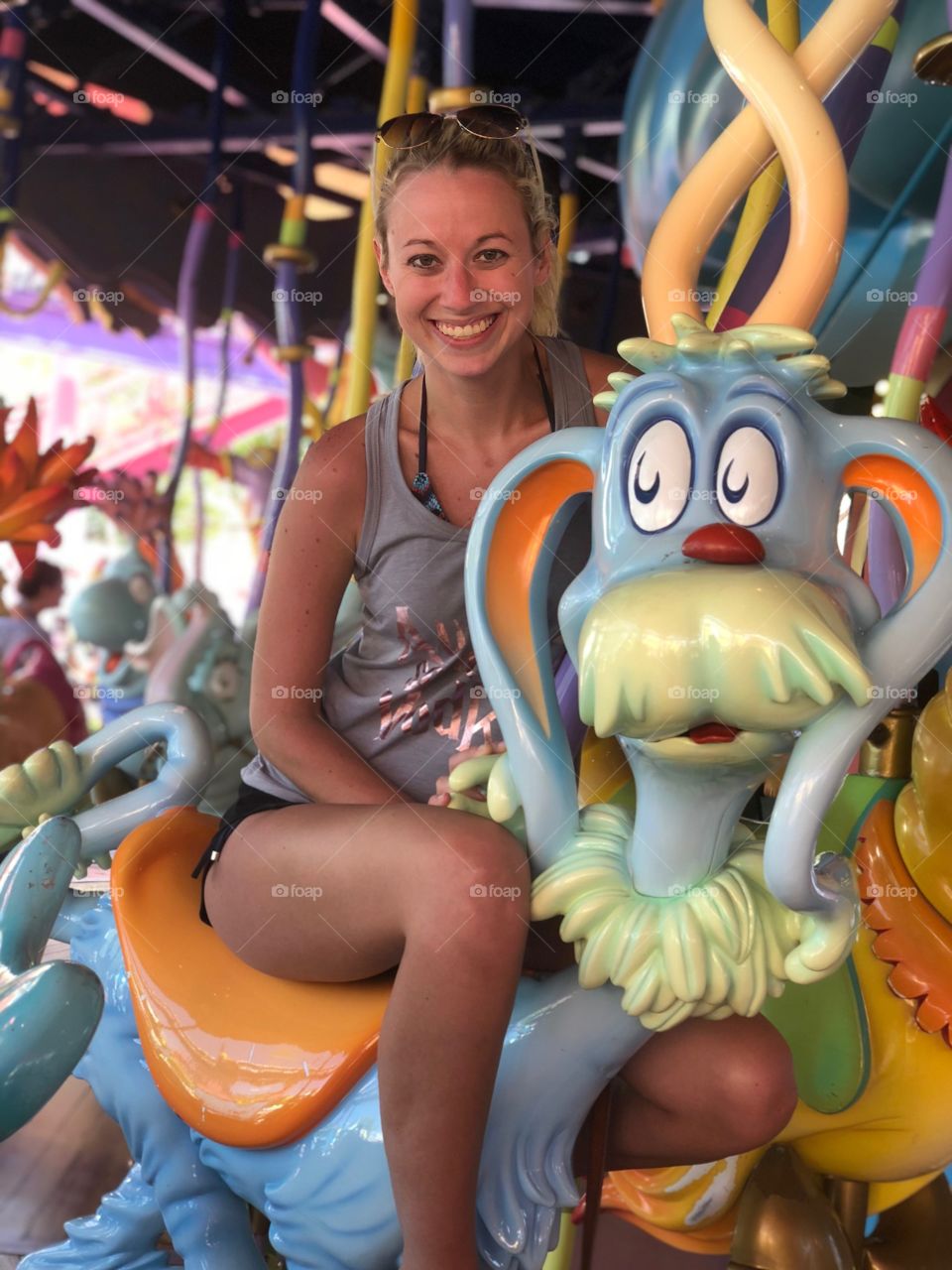 All smiles riding the Dr. Suess carousel at Universal Studios in Florida. Vacation time Is the best time!