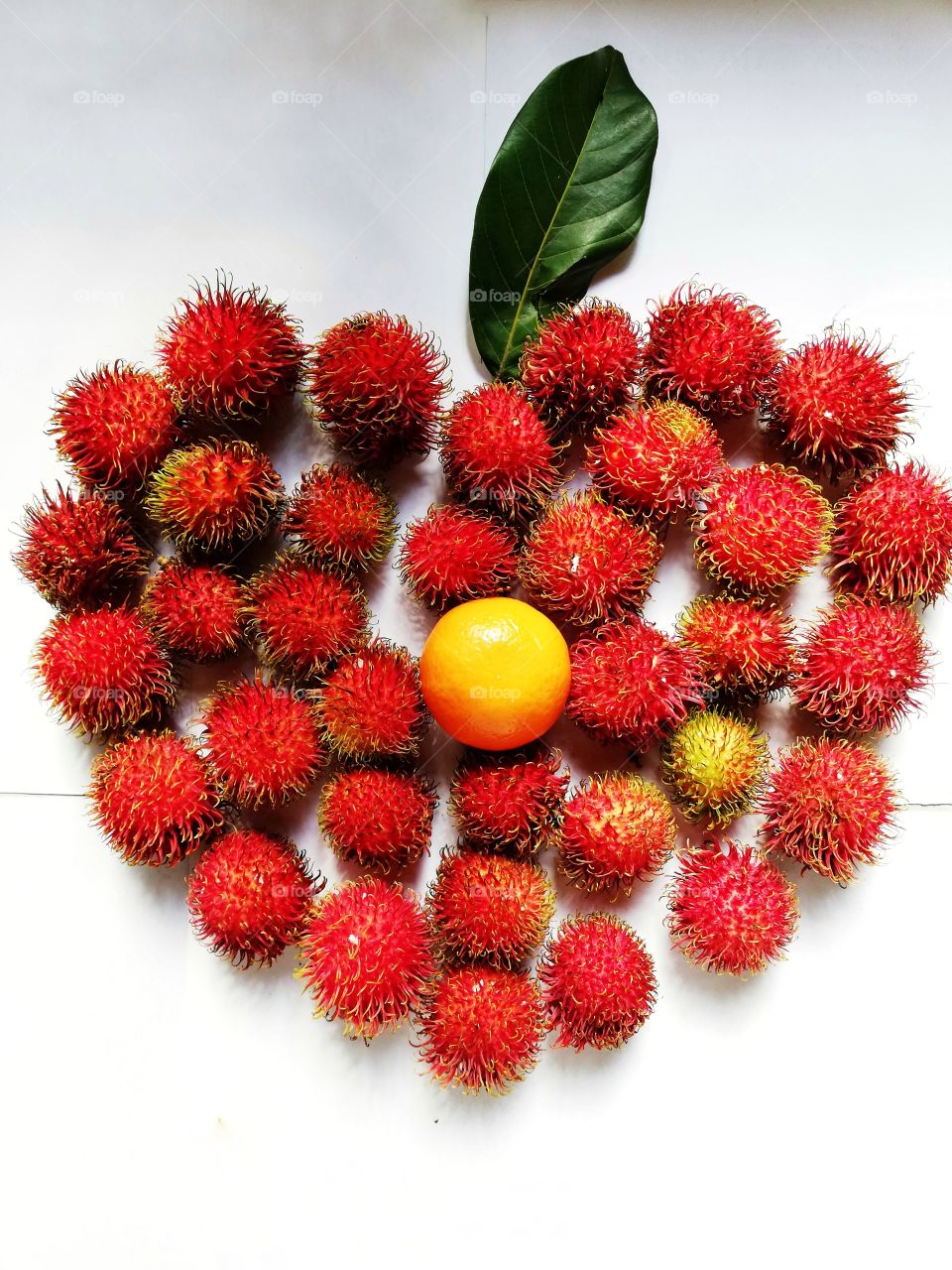 Round red fruits. Rambuttan, the Sri Lankan juicy fruit. Summer fruits make us healthy.