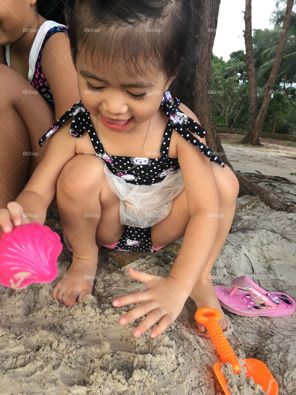 Girl playing sand so funny