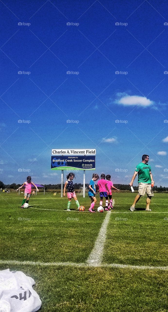 Soccer practice following the leader