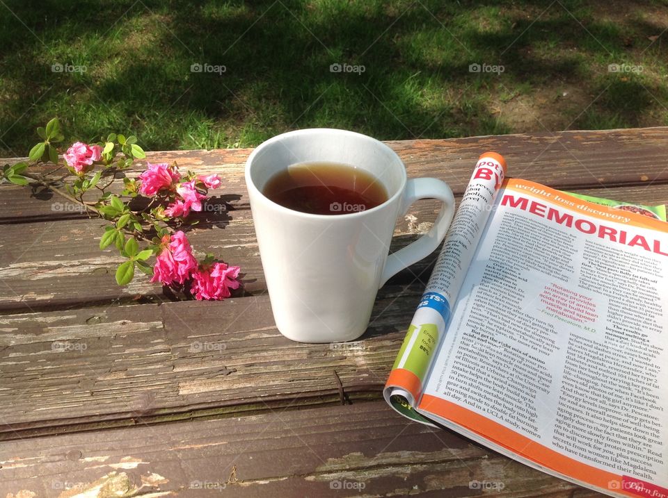 Enjoying a cup of coffee on a beautiful spring day outdoors.