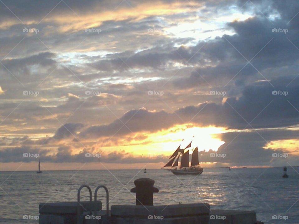tall ship in sunset on the ocean
