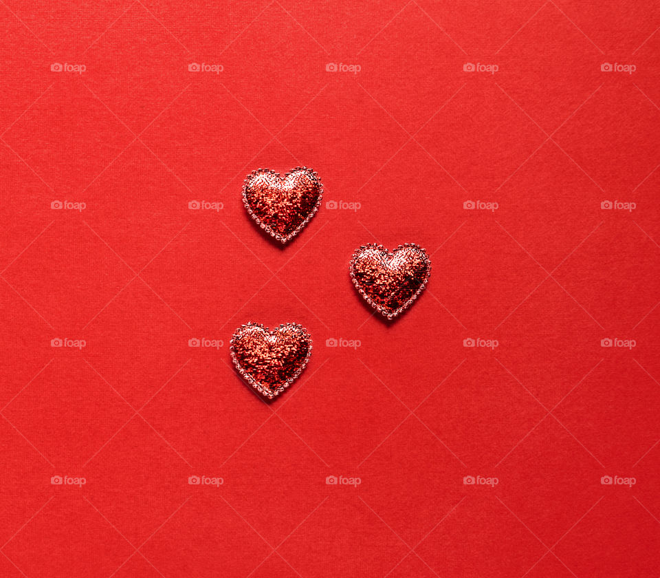 Red hearts on a red background. Valentine's Day. Postcard. Red pepper.