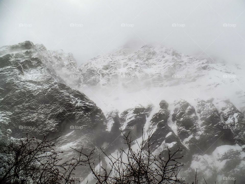 The stormy mountainside of Mt. Machapuchare on the way to Annapurna Base Camp in Nepal.