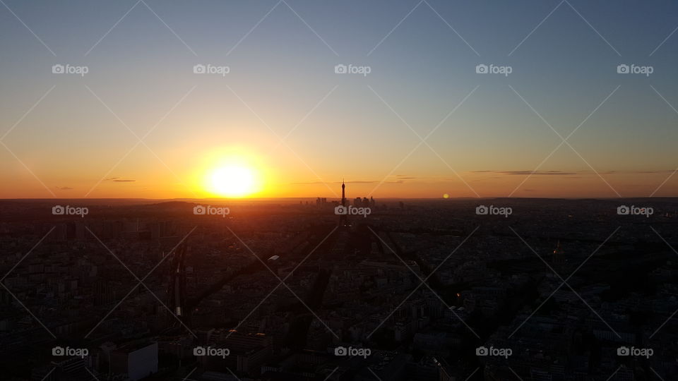 View of Paris from the Montparnasse tower just before night with a beautiful sunset