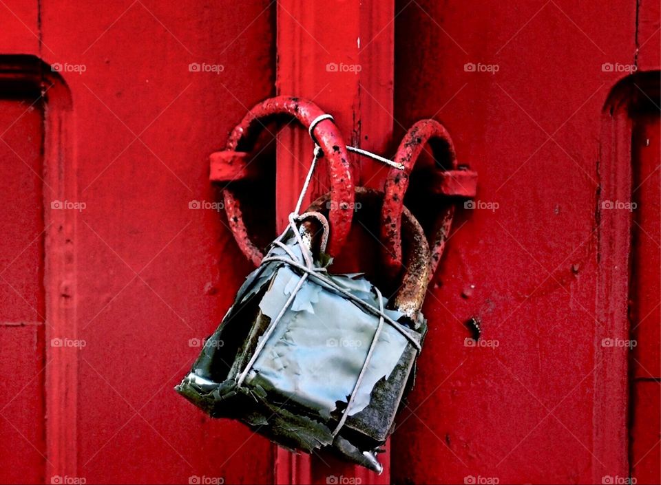 Bright red door with old padlock, doors of Greece, portrait of a door, antique doors, red antique doors, red colors in architecture 