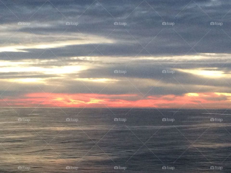 sunrise and clouds in open ocean