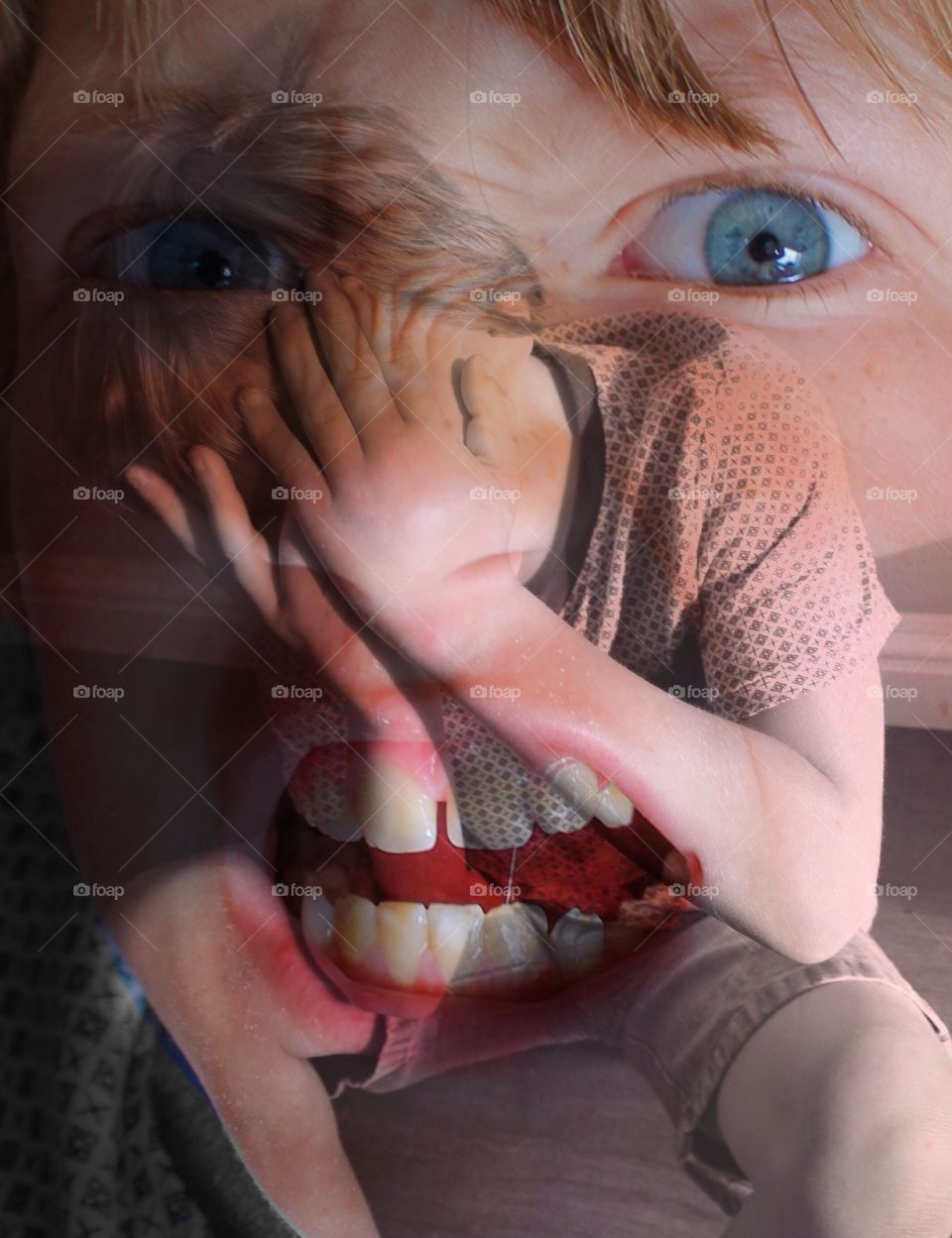 Distraught child. Child crying on the floor with a double exposure image overlaid of the same child screaming 