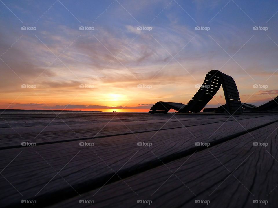 Empty chair near sea