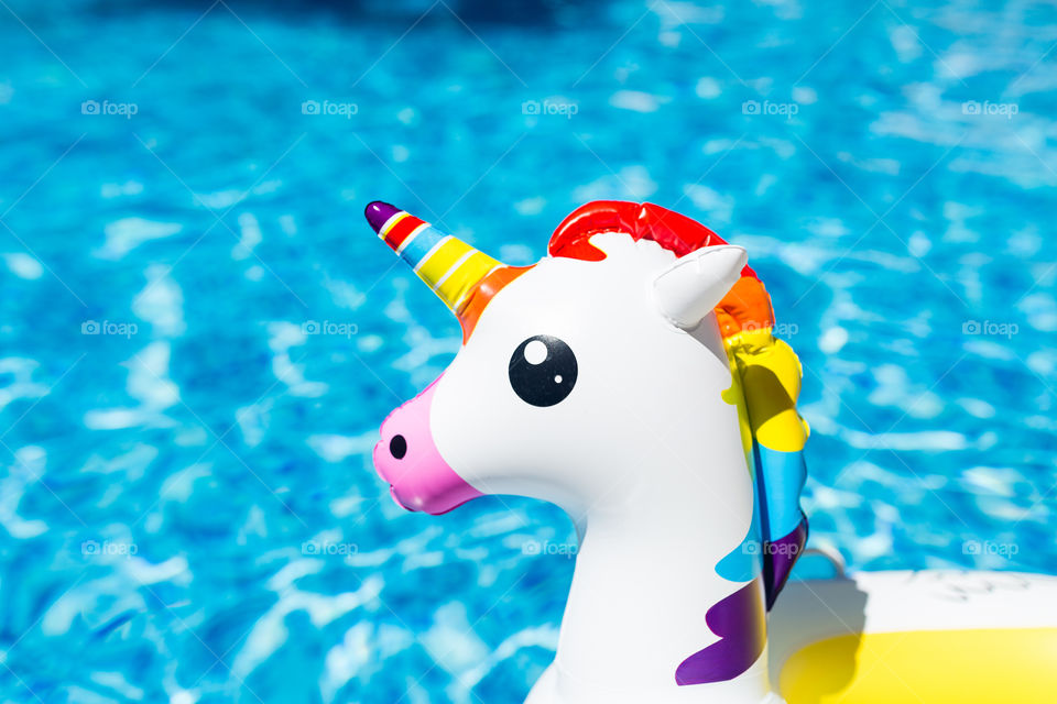 Inflatable unicorn in swimming pool 