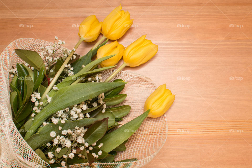 Yellow Tulips Bouquet Flowers Isolated On Wooden Background
