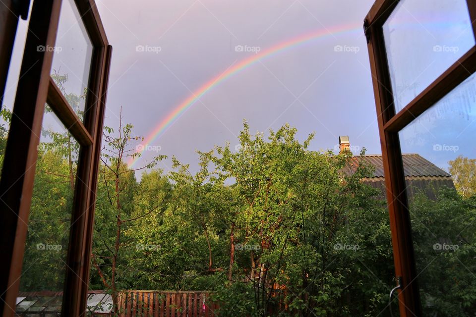 Window view of the rainbow in the village