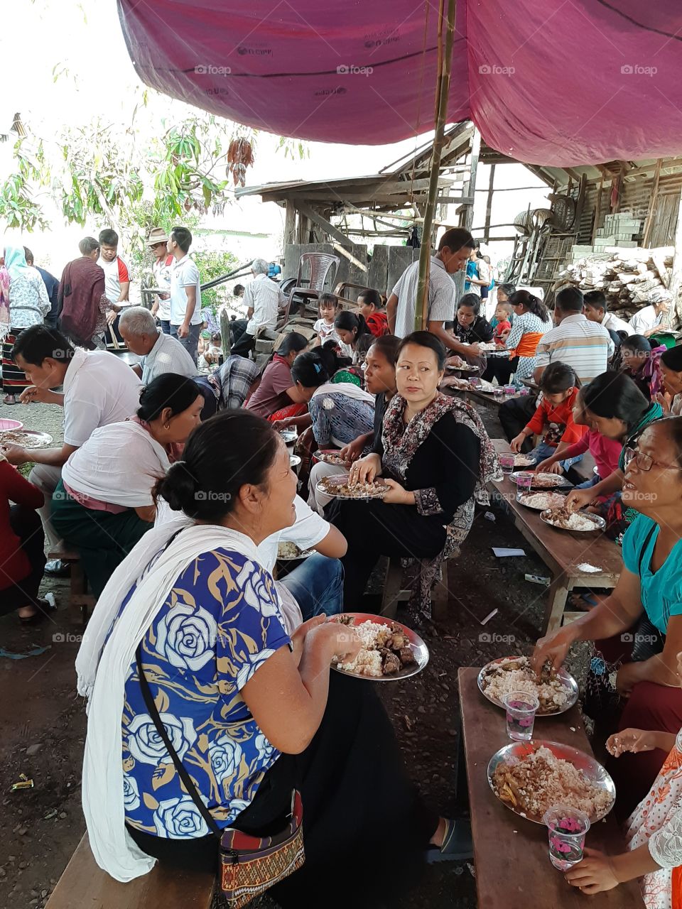 feast organised in the courtyard under canopy of tent...observe traditional way of eating...nobody seem to complain eating that way with hand
