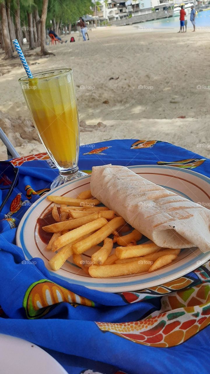 wrap and fries by the beach