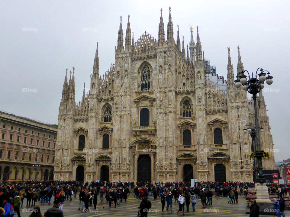 Crowd in the square where is the famous Cathedral in the downtown of Milan,Italy